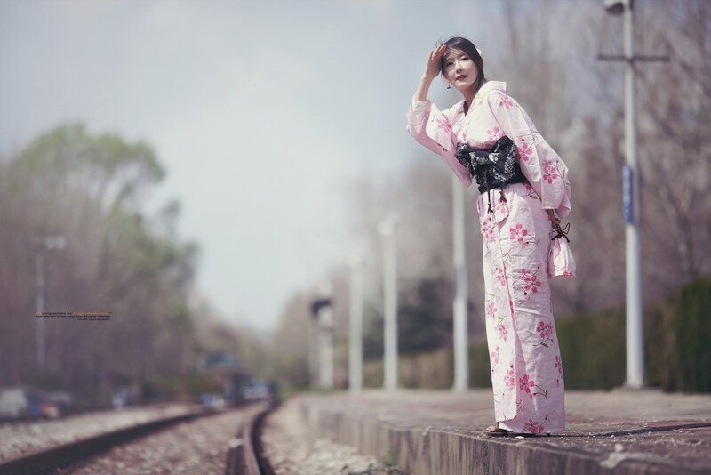 Woman in kimono on train platform