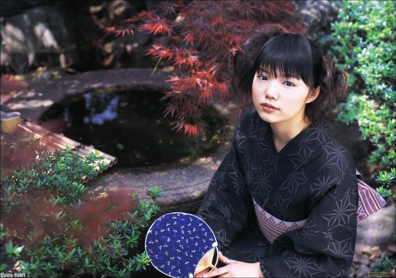 Woman in kimono with fan
