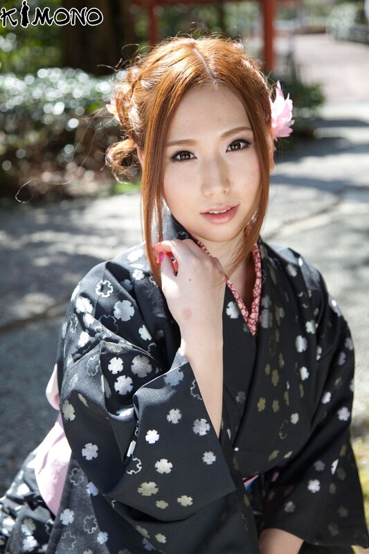 Woman in kimono with flower