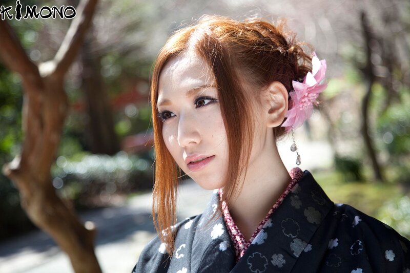 Woman in kimono with flower