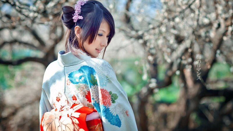 Woman in kimono with plum blossoms