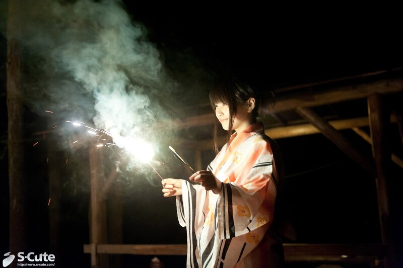 Woman in kimono with sparkler