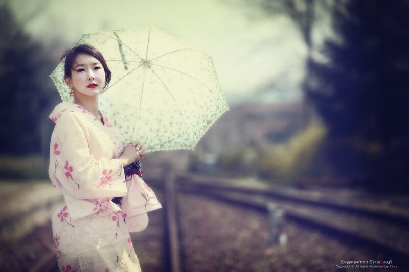 woman in kimono with umbrella