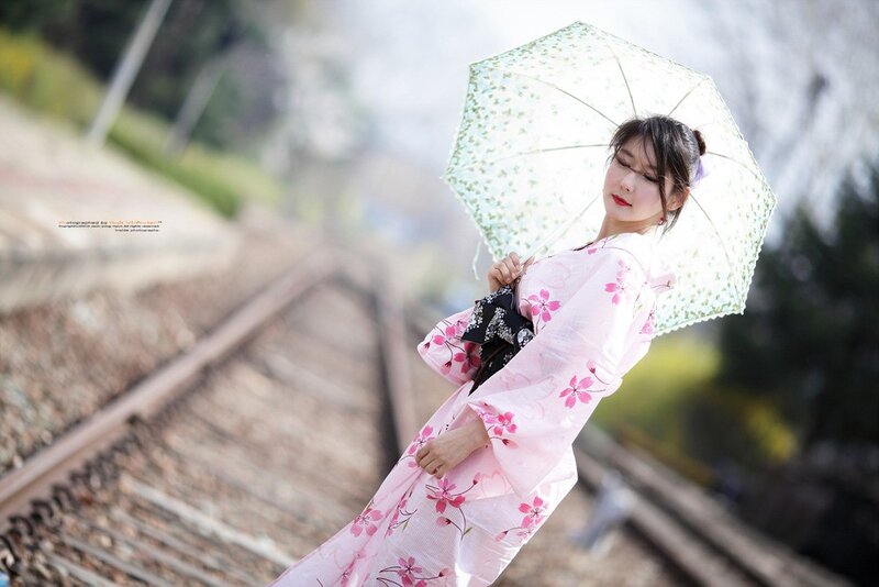 Woman in kimono with umbrella