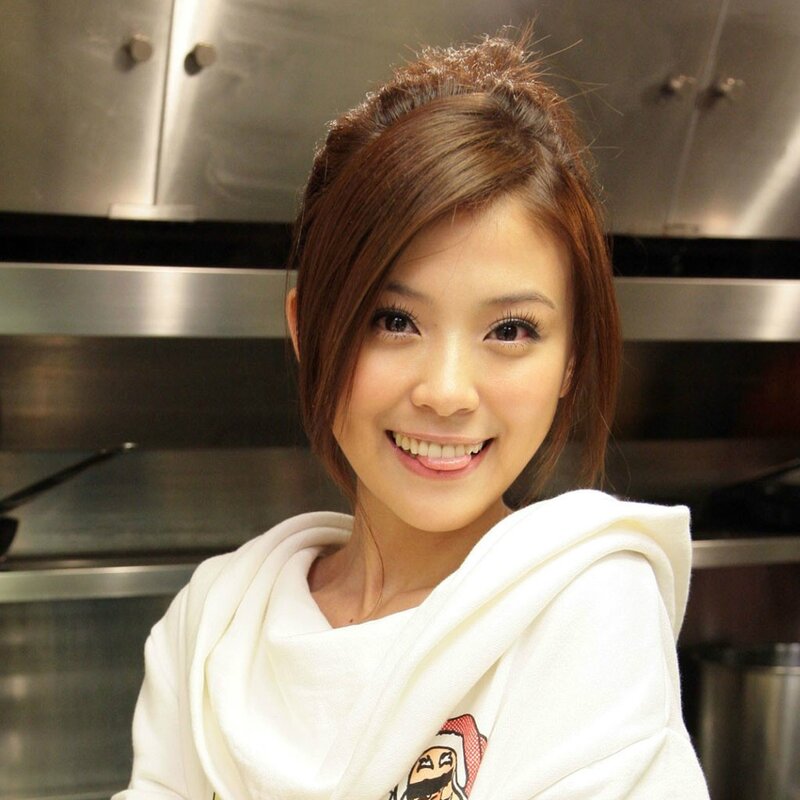 woman in kitchen smiling