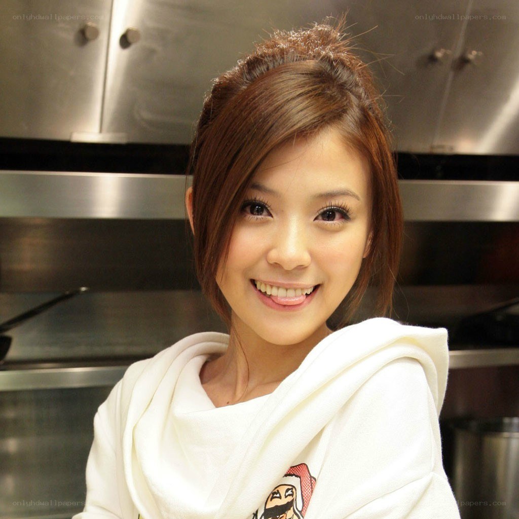 woman in kitchen smiling
