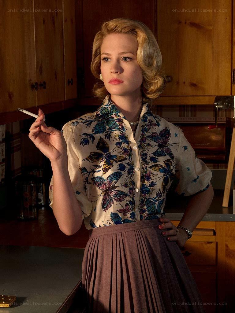 woman in kitchen with cigarette