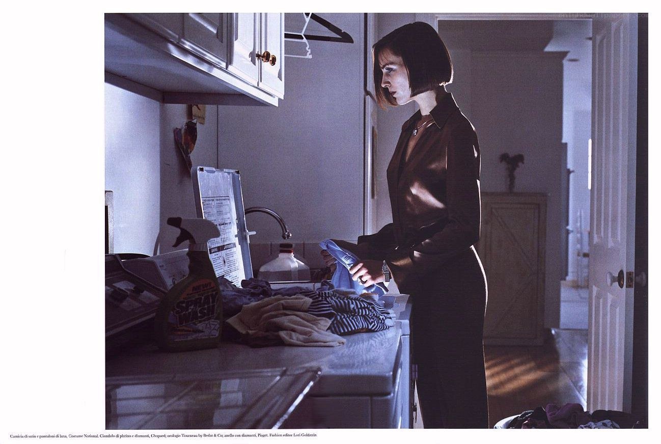 woman in kitchen with laundry