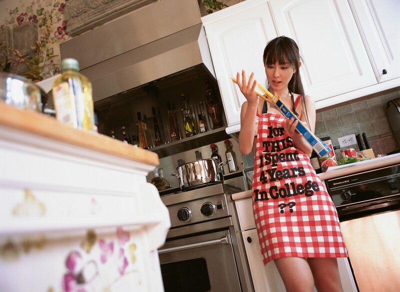 Woman in kitchen with pasta