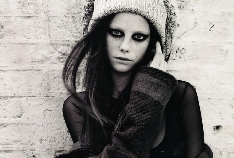 woman in knit hat and dark makeup