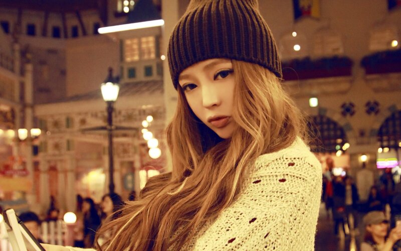 woman in knit hat at night