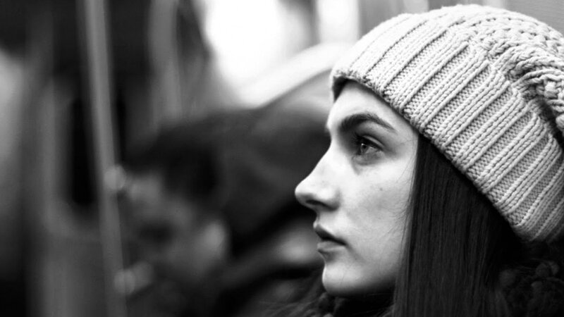 woman in knit hat looking away