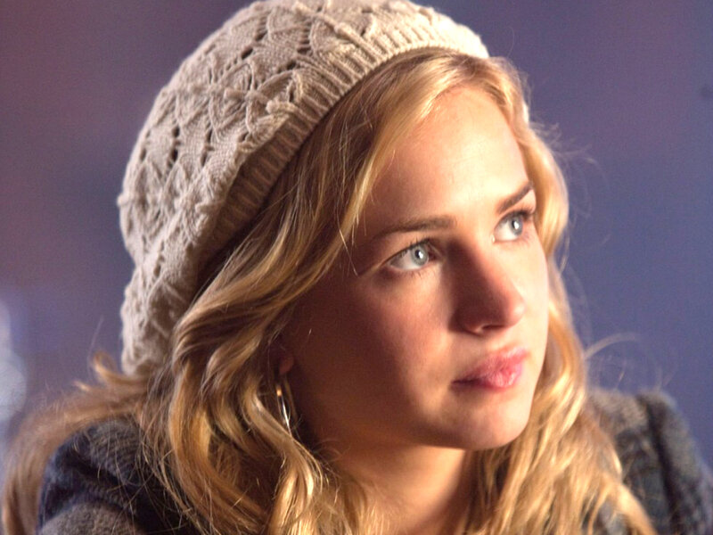 woman in knit hat looking away
