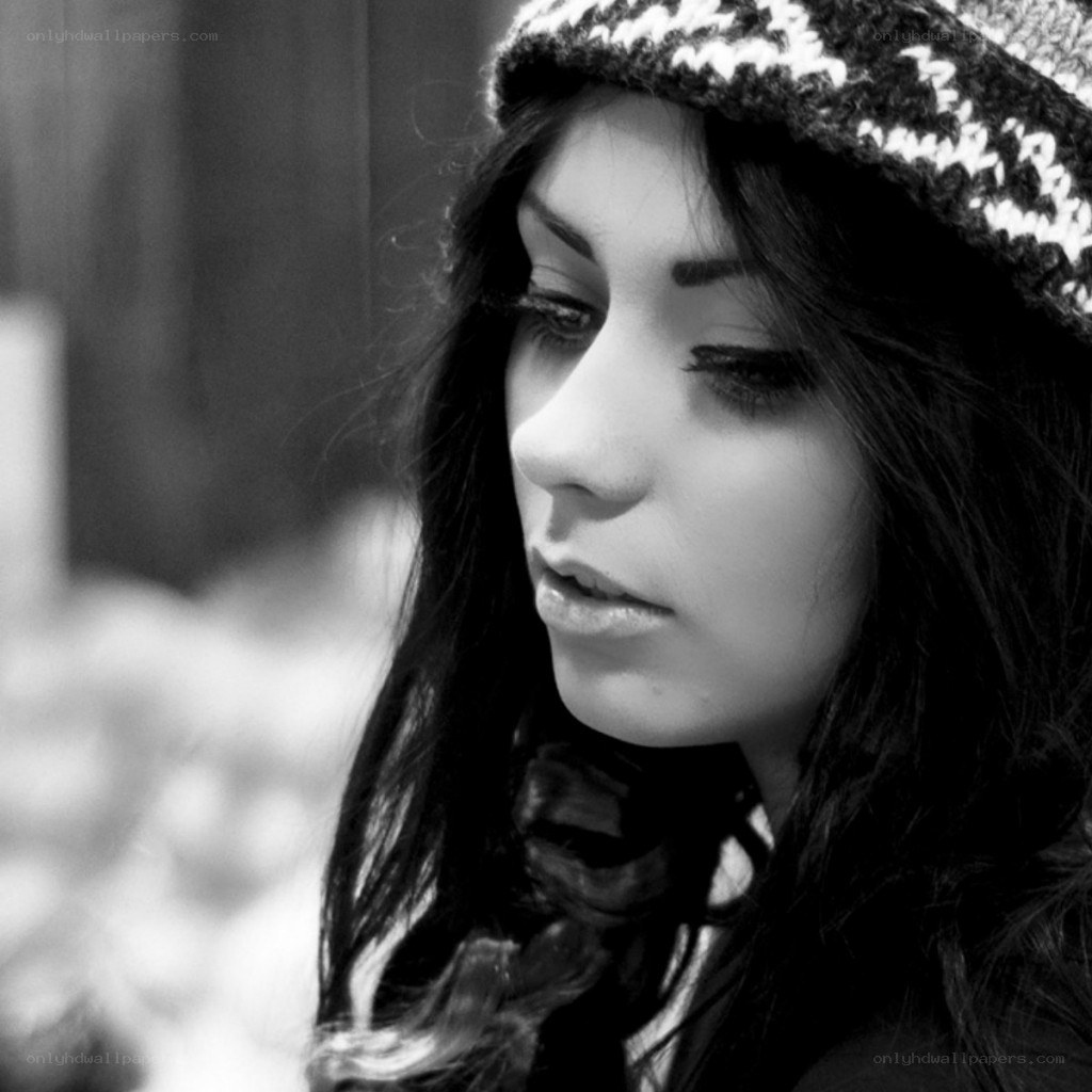 woman in knit hat looking down