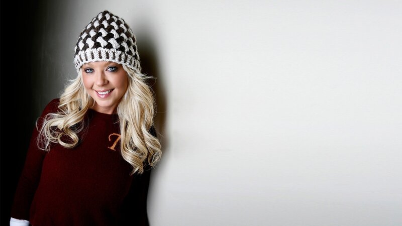 woman in knit hat smiling