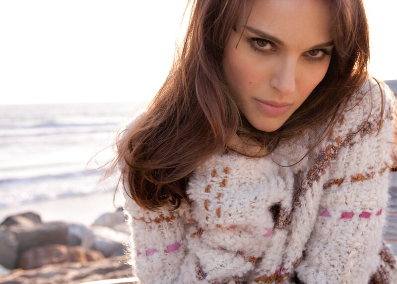 woman in knit sweater at beach