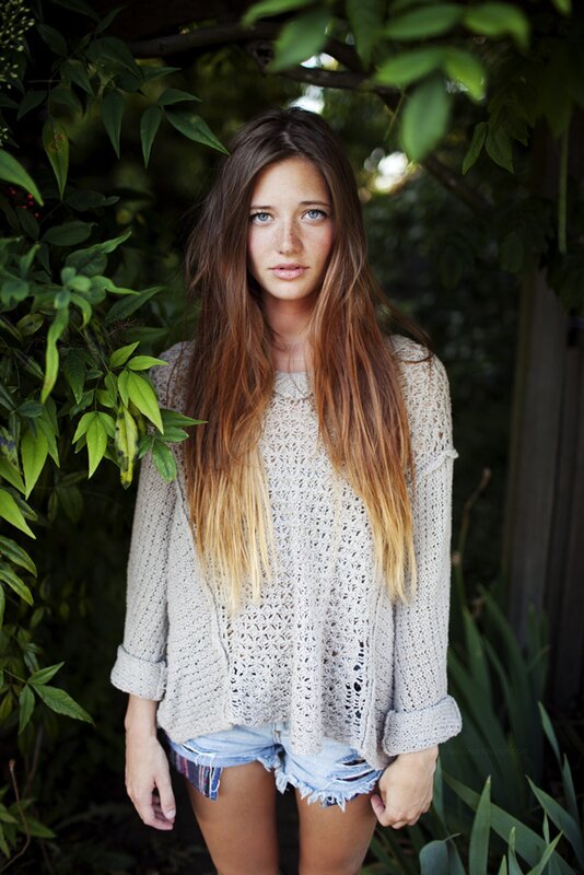 woman in knit sweater outdoors