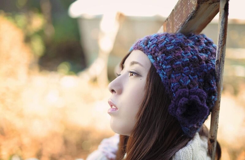 woman in knitted hat outdoors
