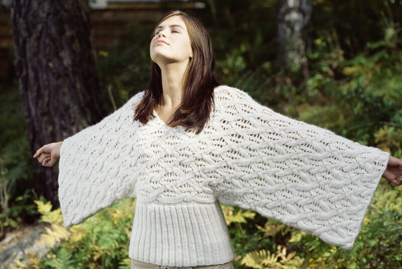 Woman in knitted sweater outdoors