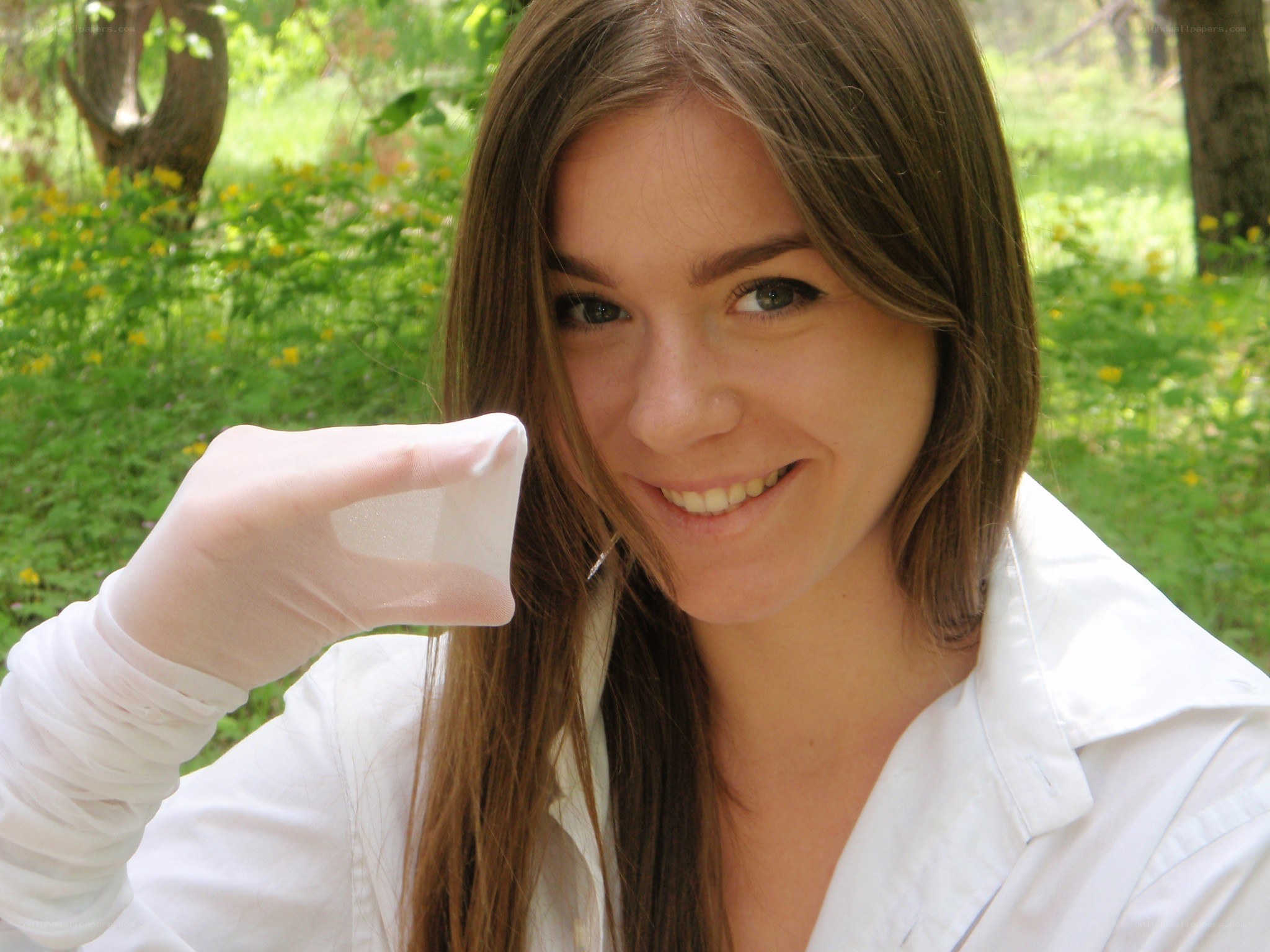 woman in lab coat holding sample