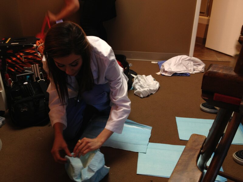 woman in lab coat on floor