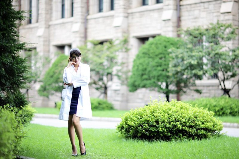 woman in lab coat outdoors