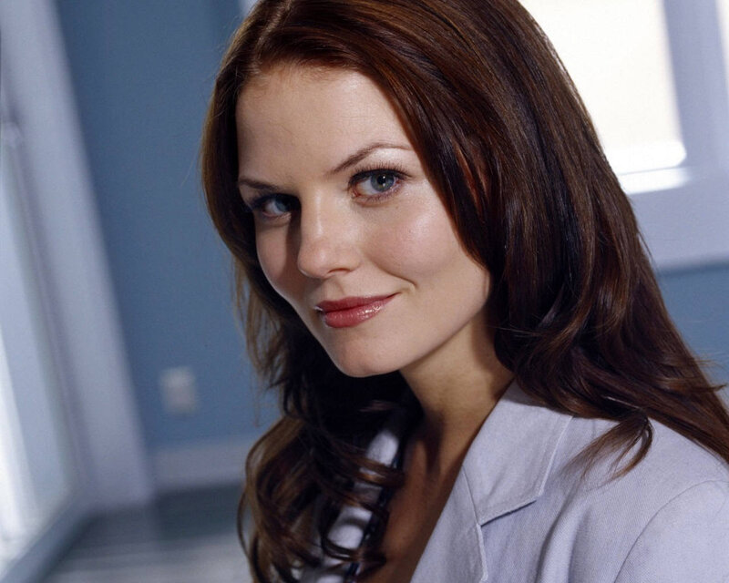 woman in lab coat smiling