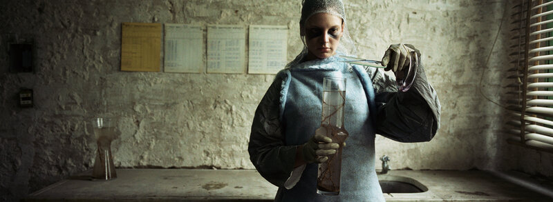 woman in lab holding vials