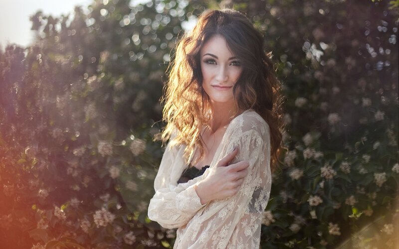 woman in lace by flowers