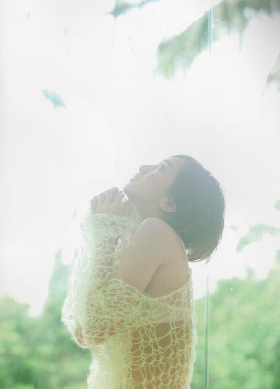 woman in lace by window