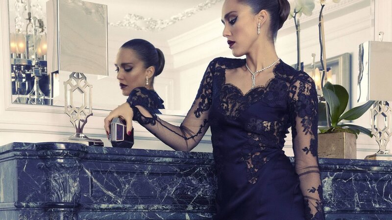 woman in lace dress at marble counter