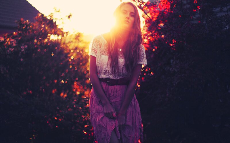 woman in lace dress at sunset
