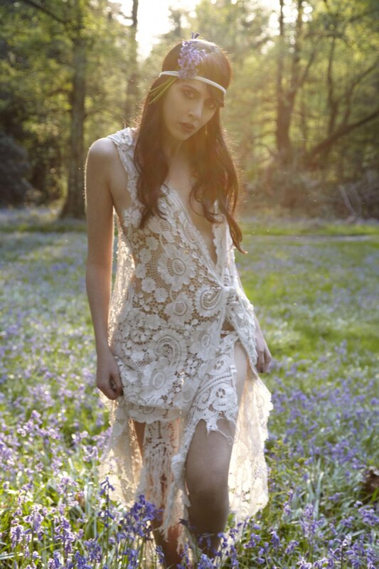 Woman in lace dress in flower field