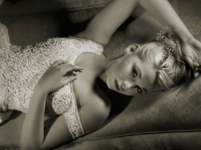 woman in lace dress lying down