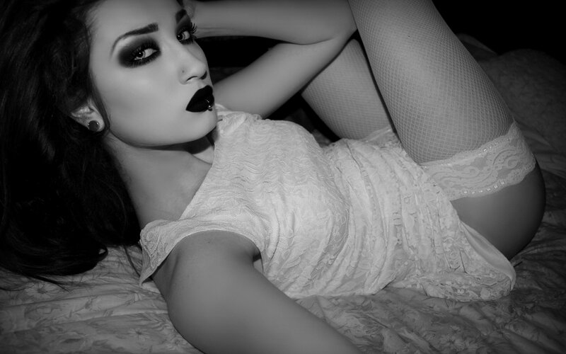 woman in lace dress lying down