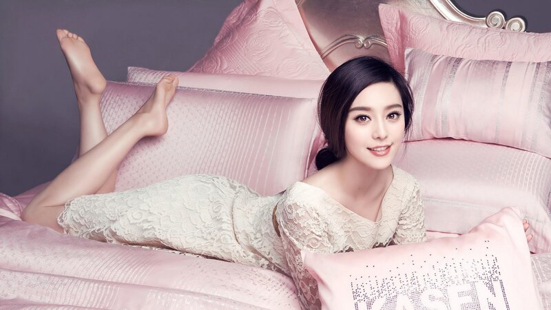 woman in lace dress on pink bed