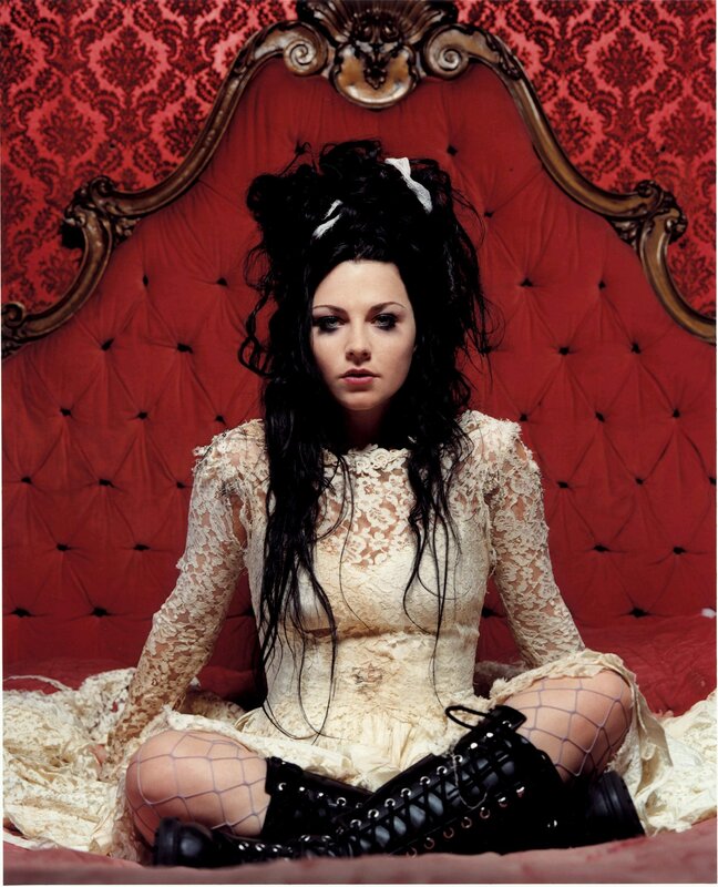 woman in lace dress on red couch