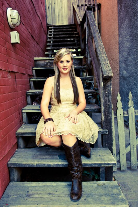 woman in lace dress on stairs