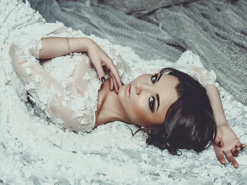 Woman in Lace Dress — White, Dramatic, Photograph, Bed