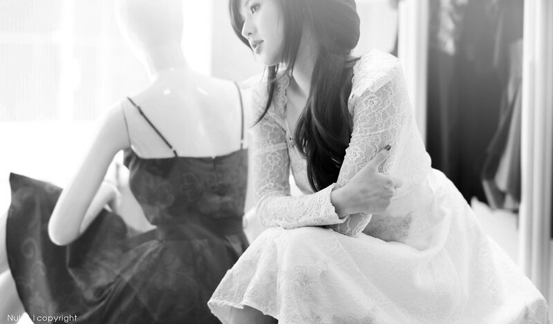 woman in lace dress with mannequin