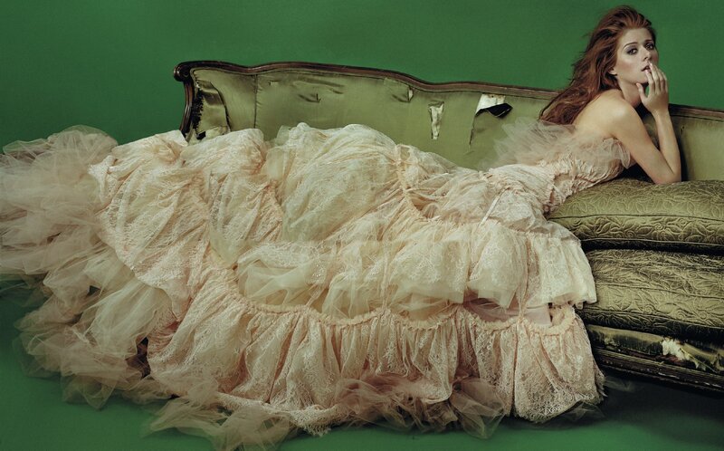 Woman in lace gown on couch