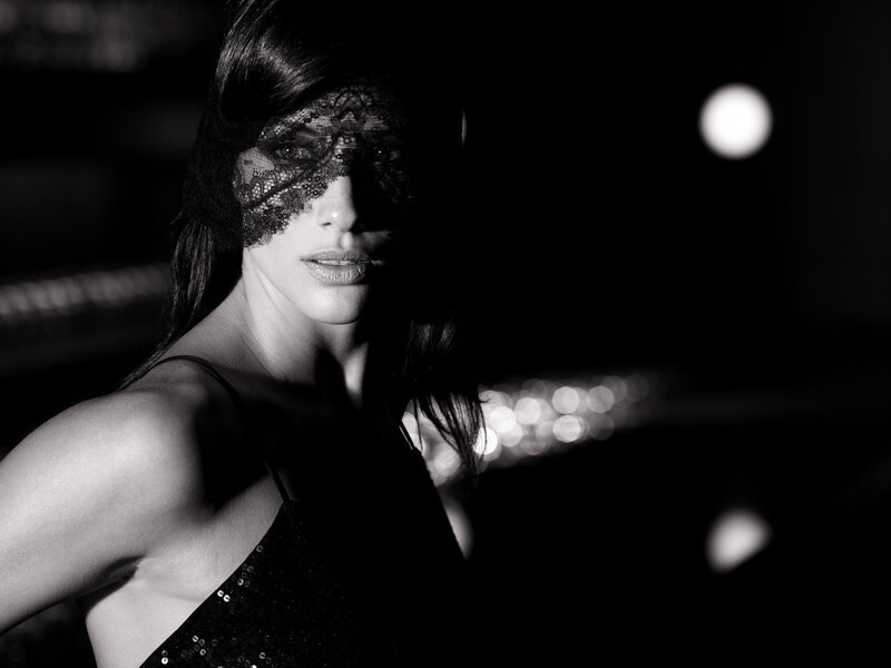 woman in lace mask at night