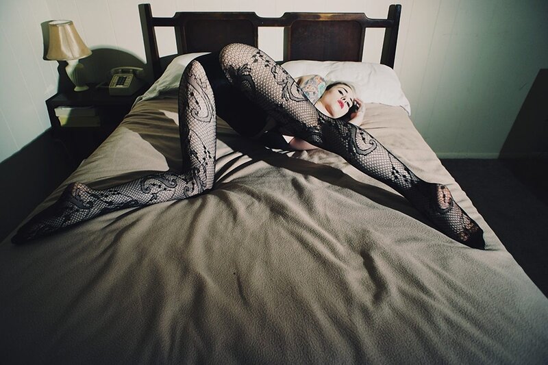 woman in lace tights on bed