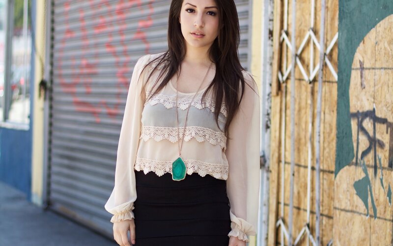 woman in lace top and black skirt