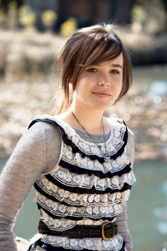 woman in lace top by water