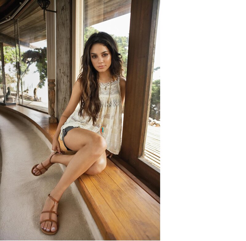 woman in lace top by window