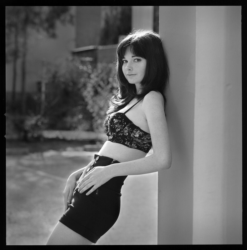 woman in lace top leaning
