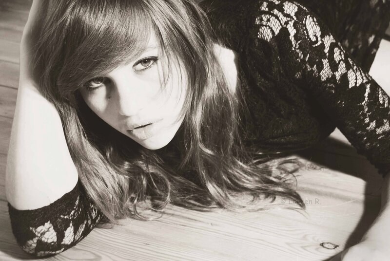 woman in lace top lying down