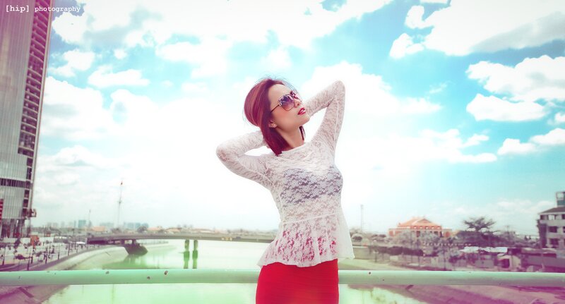 Woman in lace top on bridge