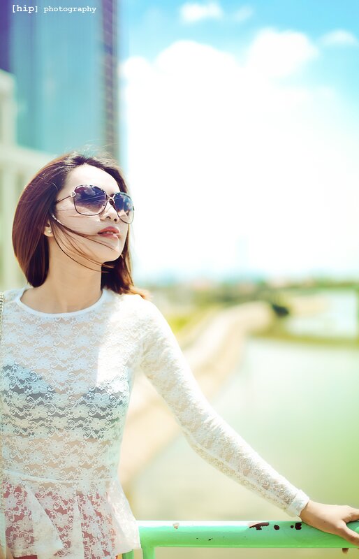 woman in lace top on bridge